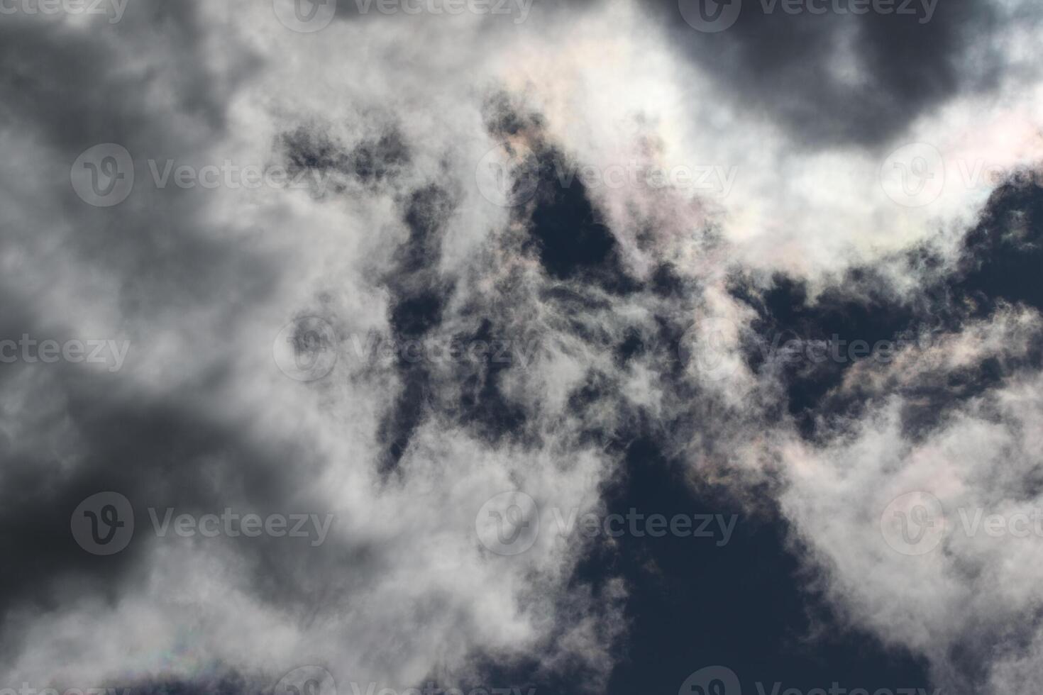 Cloudscape scenery, overcast weather above dark blue sky. Storm clouds floating in a rainy dull day with natural light. White and grey scenic environment background. Nature view. photo