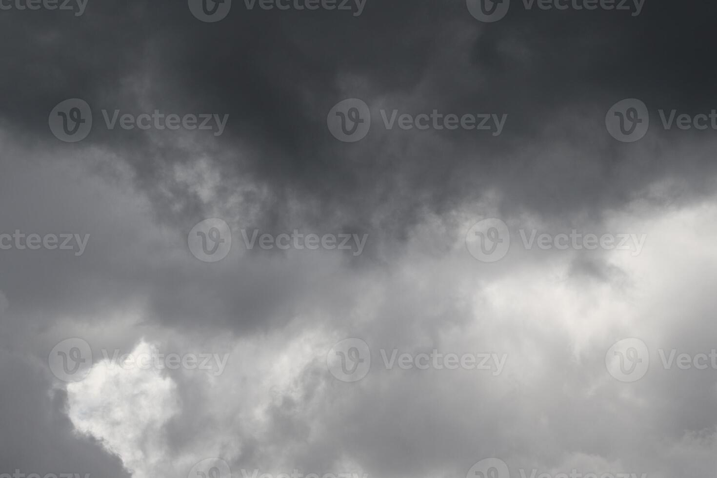 Cloudscape scenery, overcast weather above dark blue sky. Storm clouds floating in a rainy dull day with natural light. White and grey scenic environment background. Nature view. photo