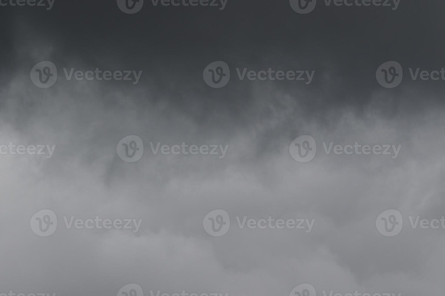 Cloudscape scenery, overcast weather above dark blue sky. Storm clouds floating in a rainy dull day with natural light. White and grey scenic environment background. Nature view. photo