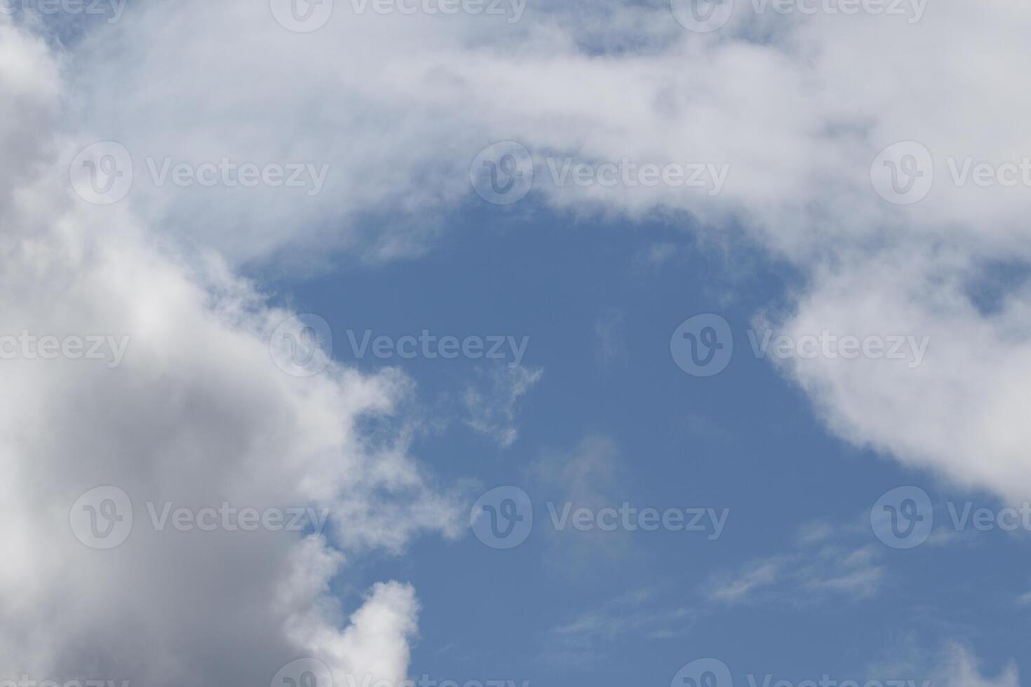 Cloudscape scenery, overcast weather above dark blue sky. Storm clouds floating in a rainy dull day with natural light. White and grey scenic environment background. Nature view. photo