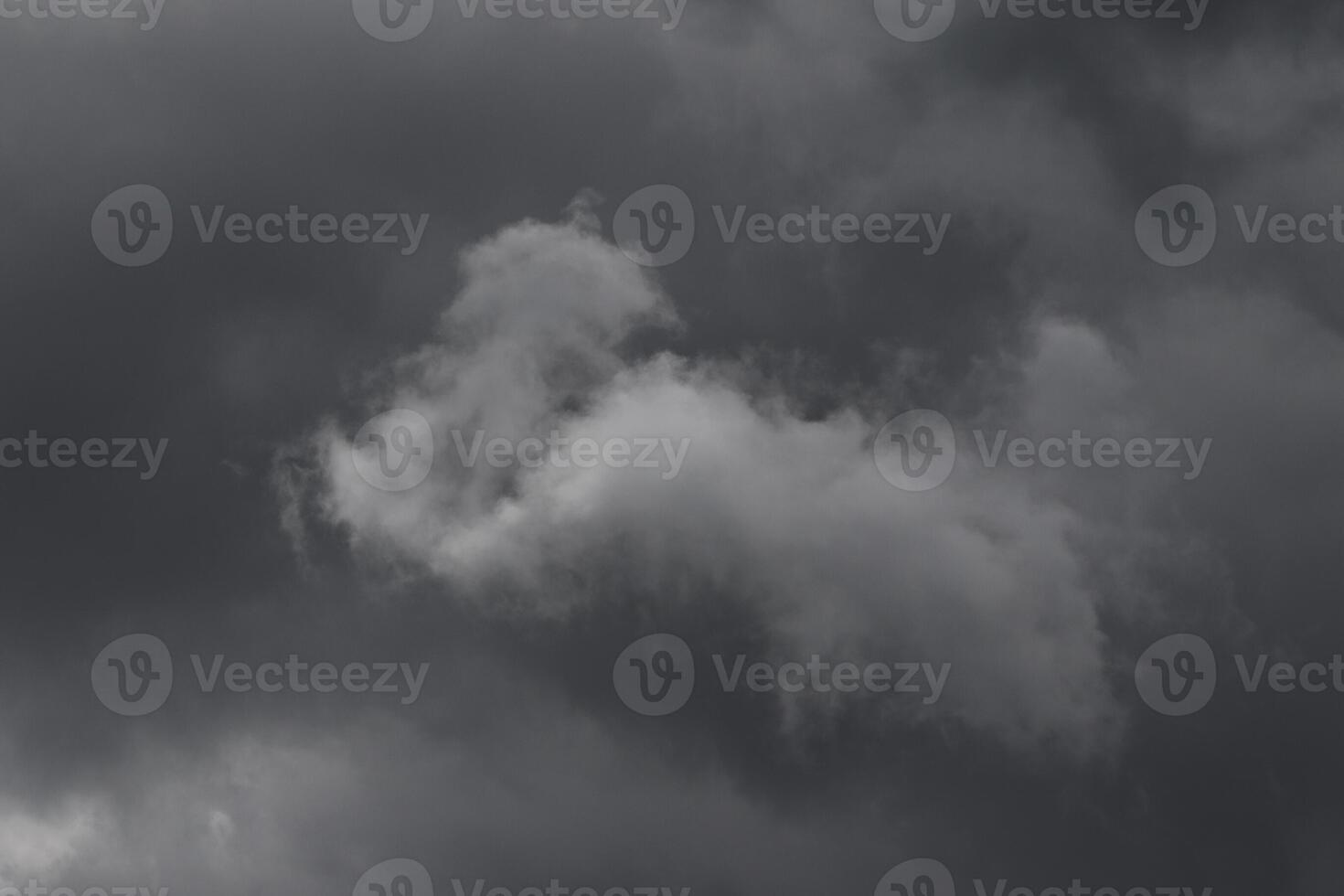 Cloudscape scenery, overcast weather above dark blue sky. Storm clouds floating in a rainy dull day with natural light. White and grey scenic environment background. Nature view. photo