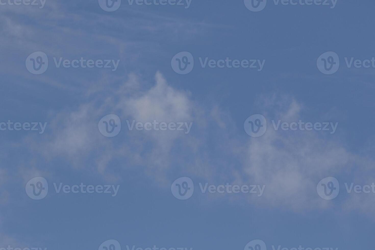 Cloudscape scenery, overcast weather above dark blue sky. Storm clouds floating in a rainy dull day with natural light. White and grey scenic environment background. Nature view. photo
