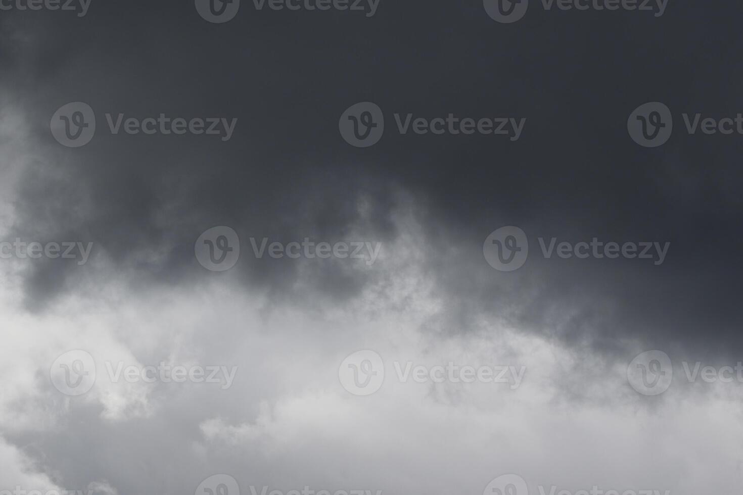 Cloudscape scenery, overcast weather above dark blue sky. Storm clouds floating in a rainy dull day with natural light. White and grey scenic environment background. Nature view. photo