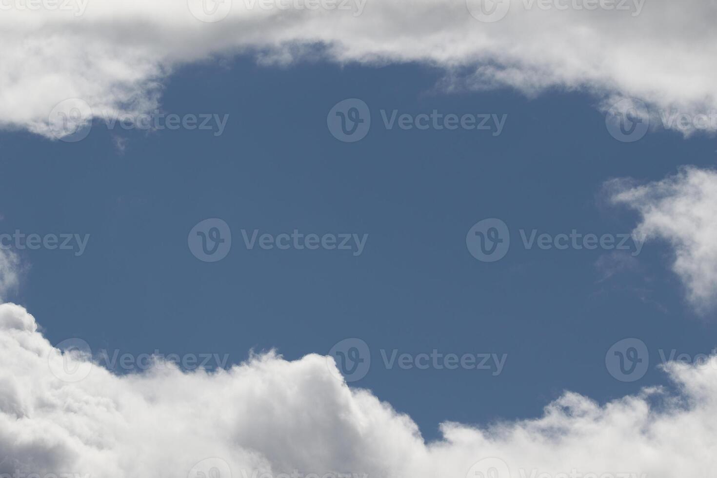 Cloudscape scenery, overcast weather above dark blue sky. Storm clouds floating in a rainy dull day with natural light. White and grey scenic environment background. Nature view. photo