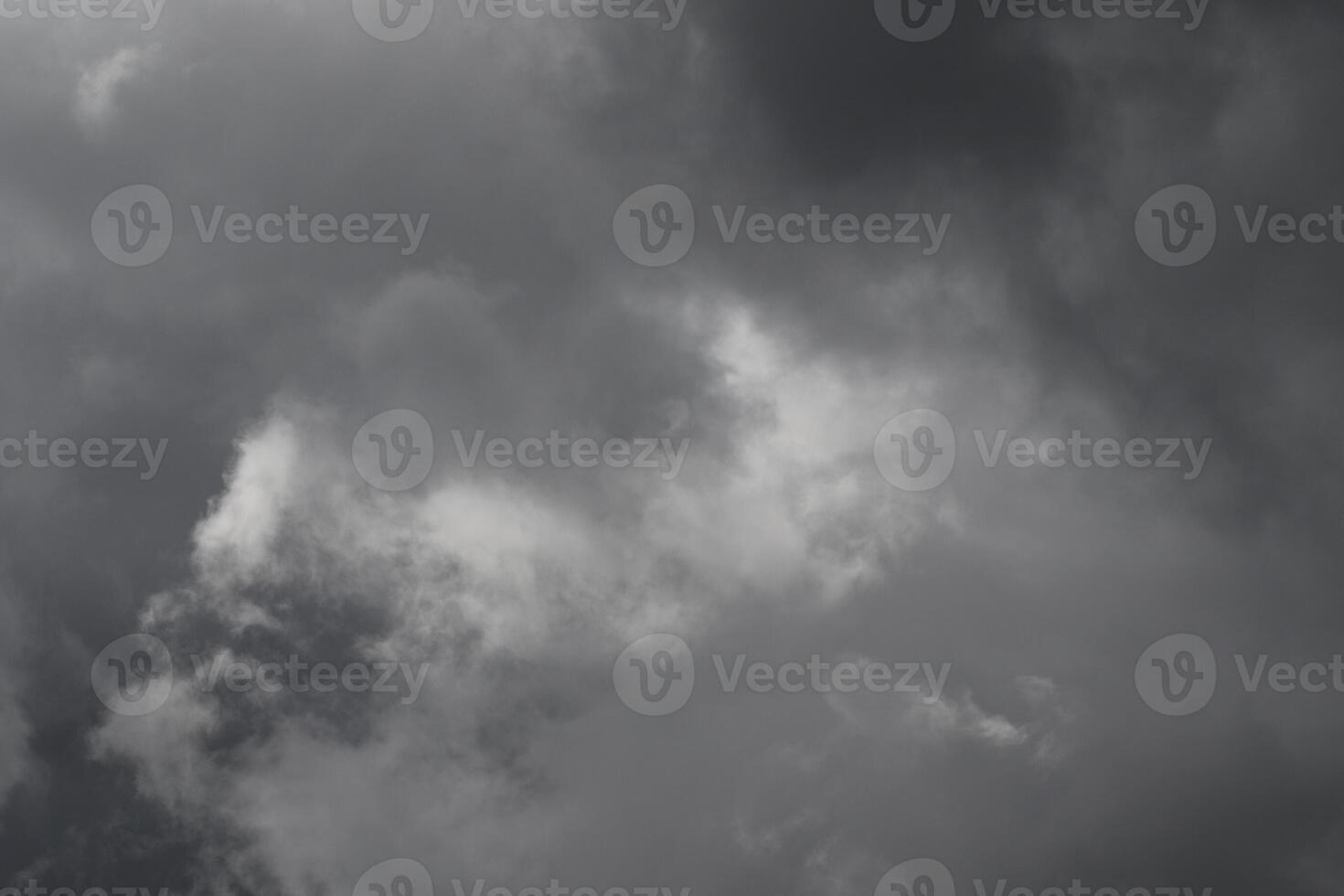Cloudscape scenery, overcast weather above dark blue sky. Storm clouds floating in a rainy dull day with natural light. White and grey scenic environment background. Nature view. photo
