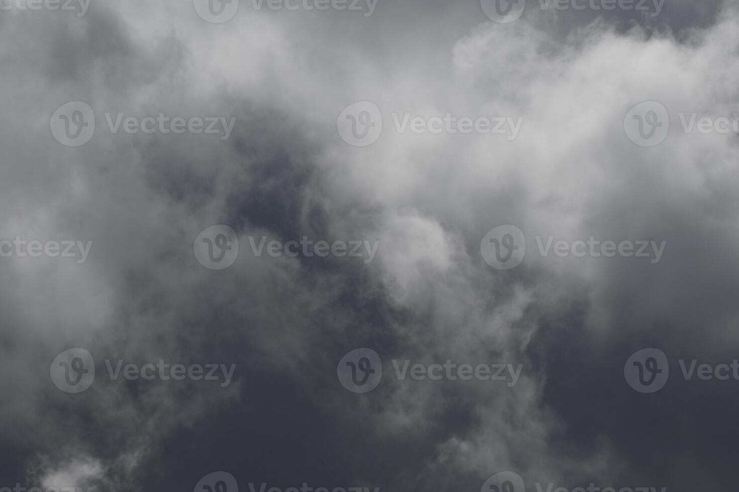 Cloudscape scenery, overcast weather above dark blue sky. Storm clouds floating in a rainy dull day with natural light. White and grey scenic environment background. Nature view. photo