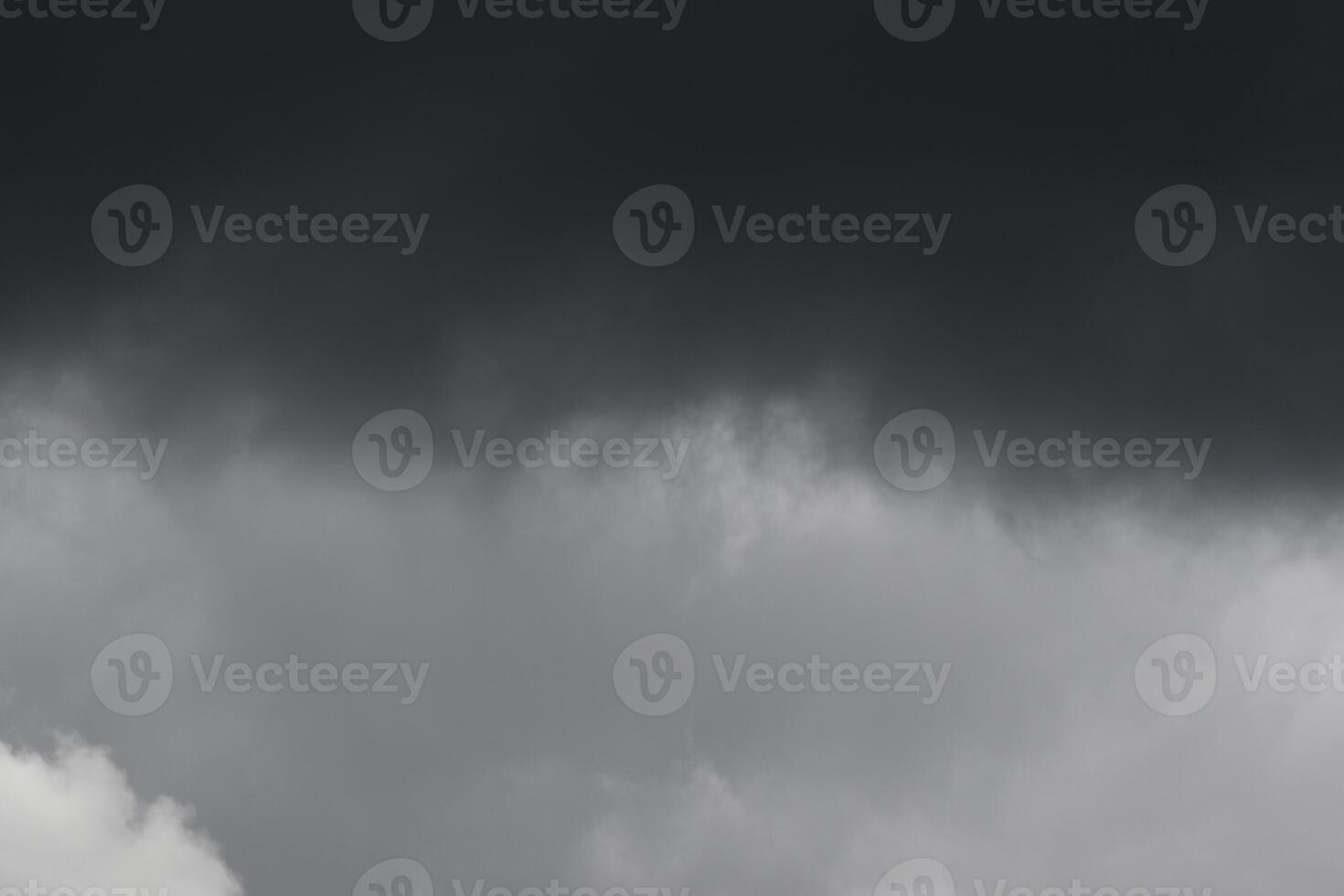 Cloudscape scenery, overcast weather above dark blue sky. Storm clouds floating in a rainy dull day with natural light. White and grey scenic environment background. Nature view. photo