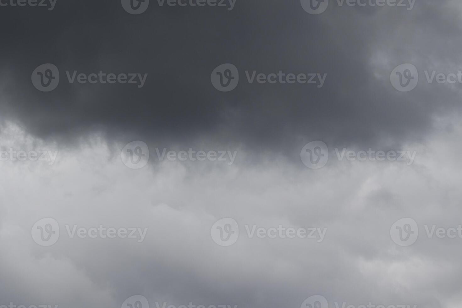 Cloudscape scenery, overcast weather above dark blue sky. Storm clouds floating in a rainy dull day with natural light. White and grey scenic environment background. Nature view. photo