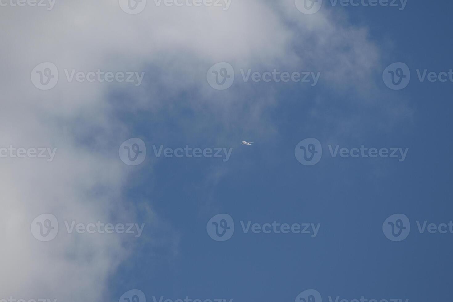 Cloudscape scenery, overcast weather above dark blue sky. Storm clouds floating in a rainy dull day with natural light. White and grey scenic environment background. Nature view. photo