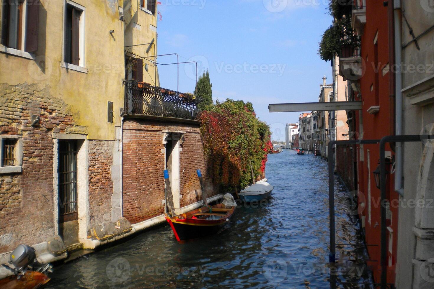 Venice Grand Canal, with its iconic winding waterway flanked by historic buildings and bustling activity, epitomizes the charm and allure of the enchanting city of Venice photo
