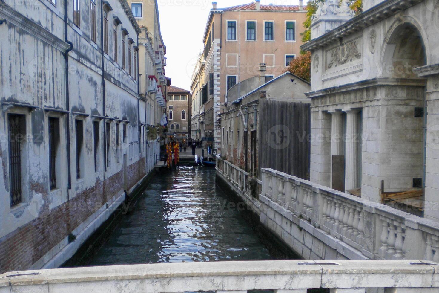Venice Grand Canal, with its iconic winding waterway flanked by historic buildings and bustling activity, epitomizes the charm and allure of the enchanting city of Venice photo