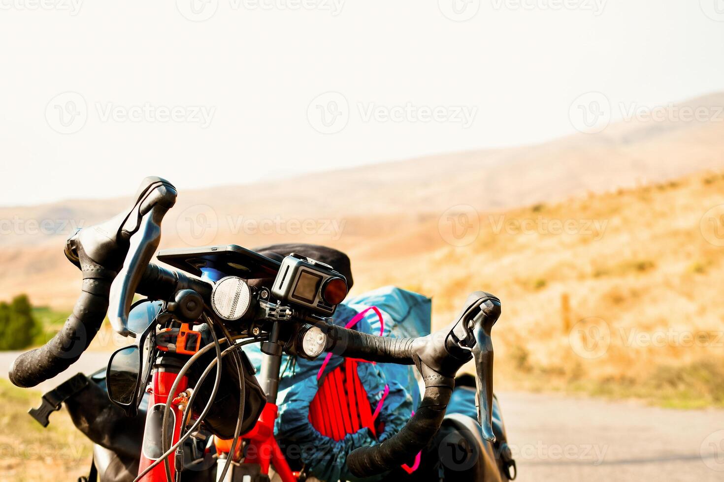 Background image of standing touring bicycle without cyclist on the road with nocars. Cycling in a countryside. Kazkbegi national park. Georgia.2020 photo