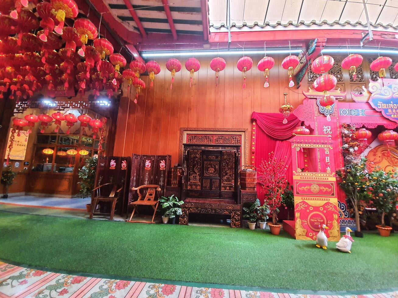 Bangkok, Thailand on July 22, 2023. The interior of the photo spot at the Wat Mangkon Kamalawat temple is filled with red decorations and the year of the rabbit logo.