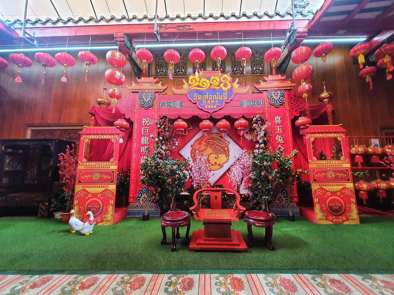 Bangkok, Thailand on July 22, 2023. The interior of the photo spot at the Wat Mangkon Kamalawat temple is filled with red decorations and the year of the rabbit logo.