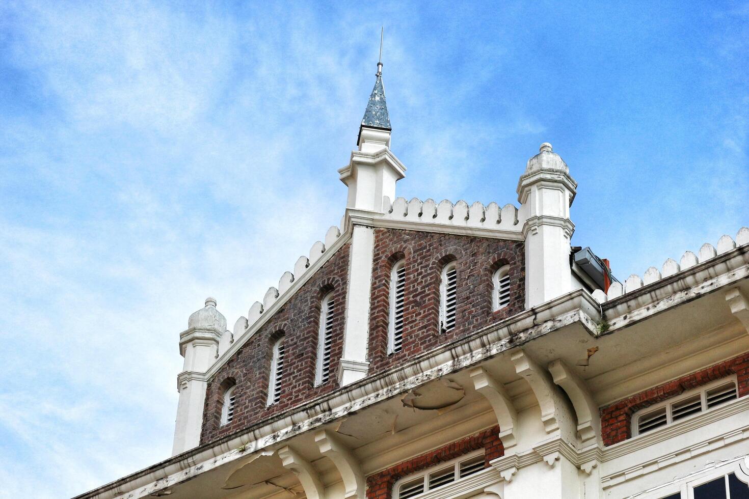Kuala Lumpur, Malaysia on May 21, 2023. The top of the building and roof of the former chartered bank building, photo
