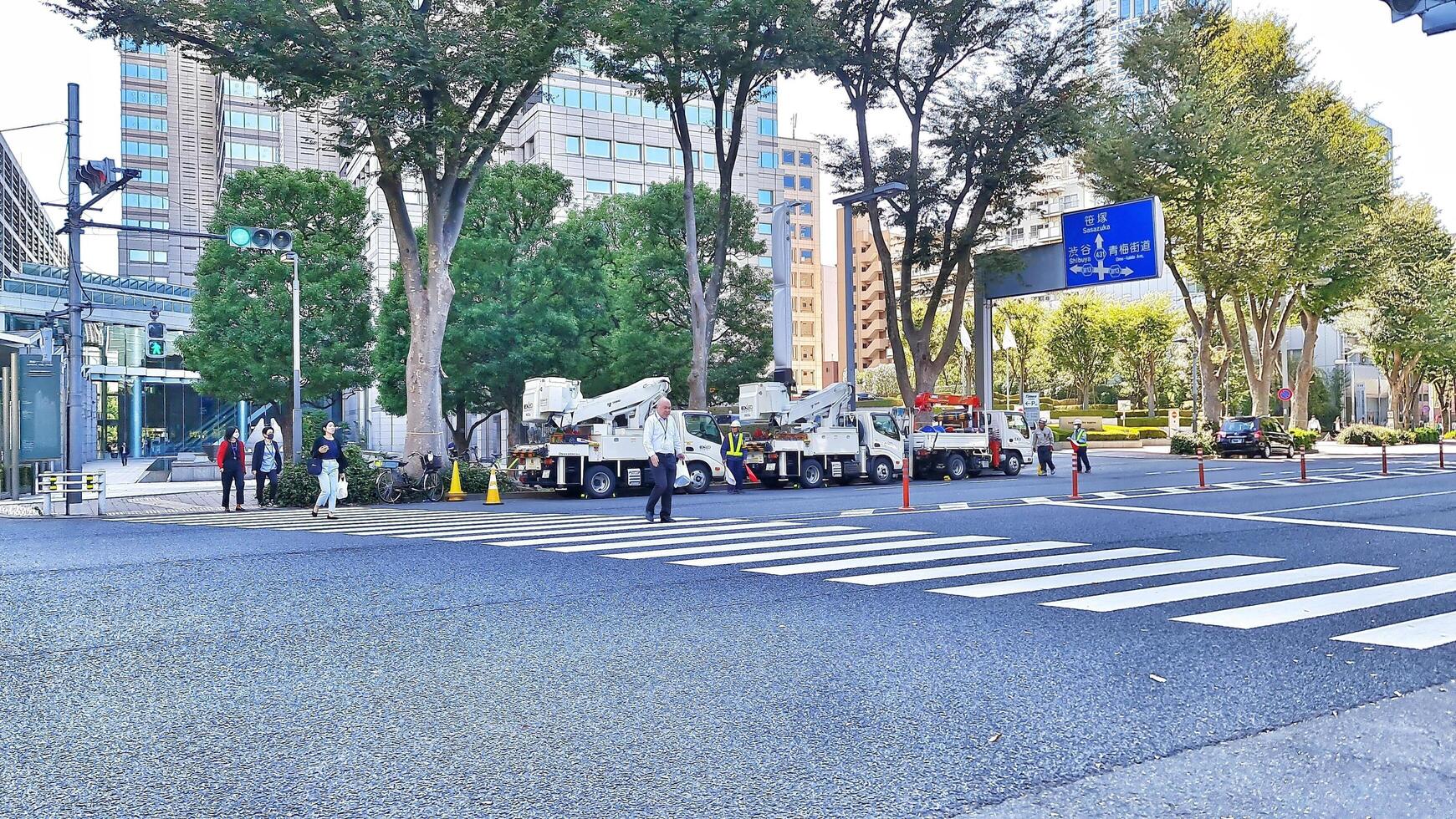 Tokyo, Japan on October 1, 2023. Several people are walking on a zebra cross. photo