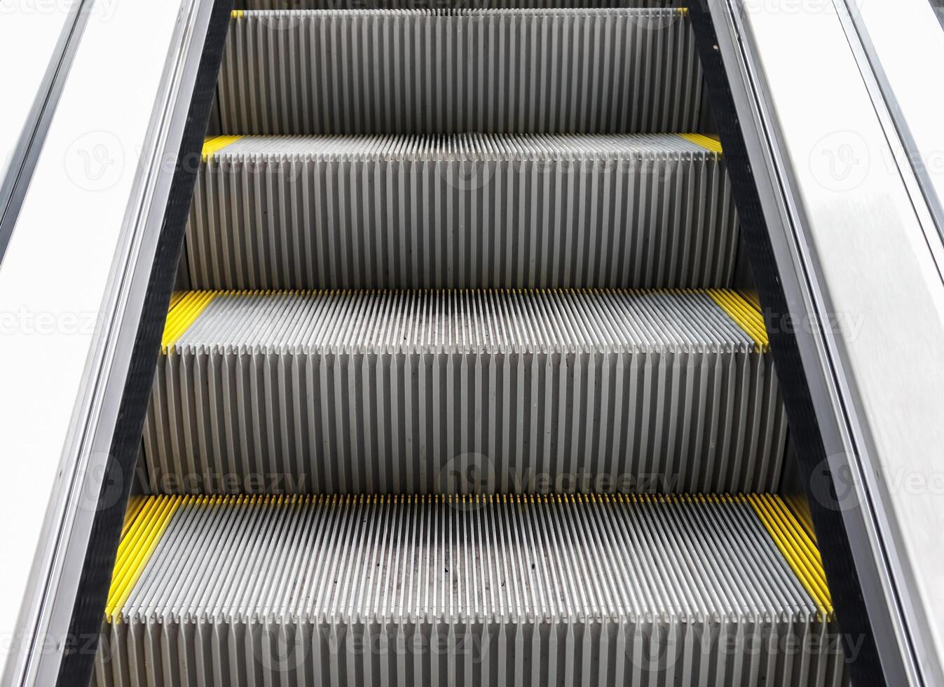 Close up of empty steps of an escalator in a perspective view. photo
