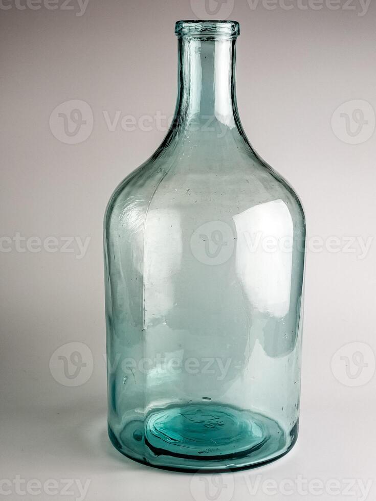 Empty old glass jar with a narrow neck for wine and spirits. Made in the USSR around 1930s photo