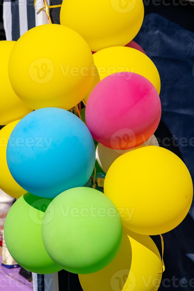 colorful balloons in front of a shop window in the city photo