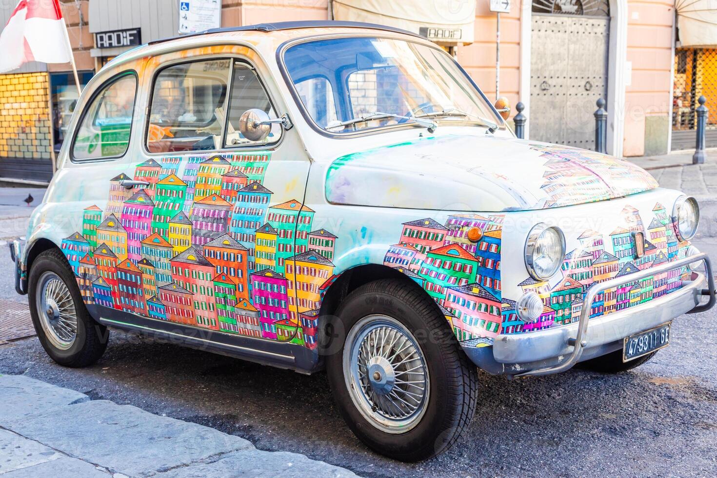 Genova, Italy - vintage Fiat 500 car painted with traditional cityscape of Liguria Region - Italy travel destination photo