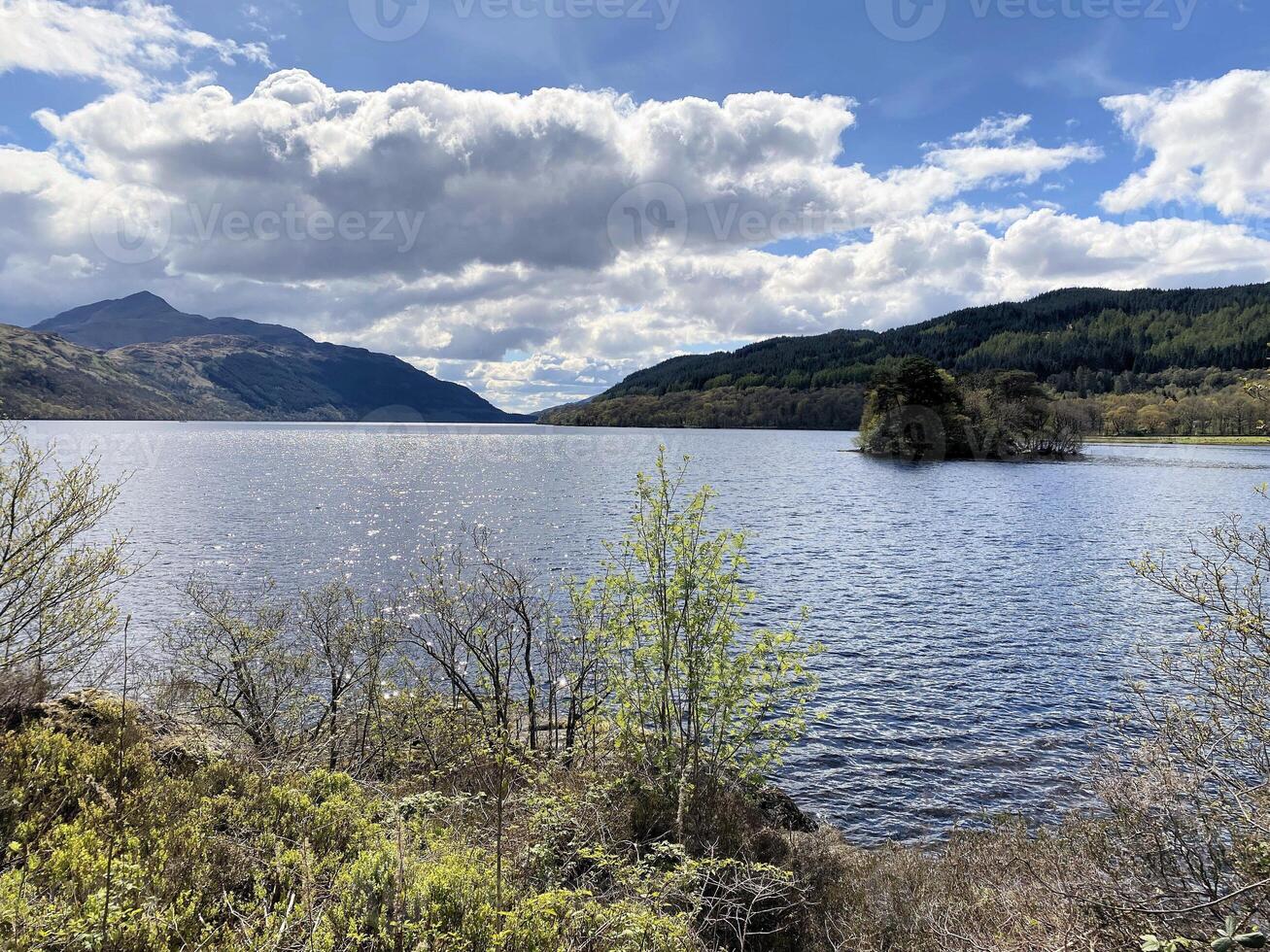 A view of Loch Lomond in Scotland on a sunny day photo
