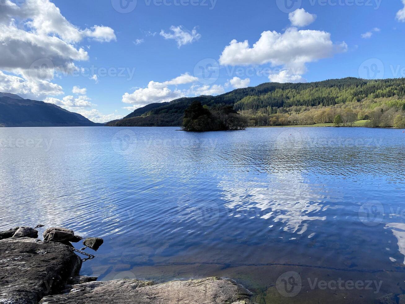 A view of Loch Lomond in Scotland on a sunny day photo