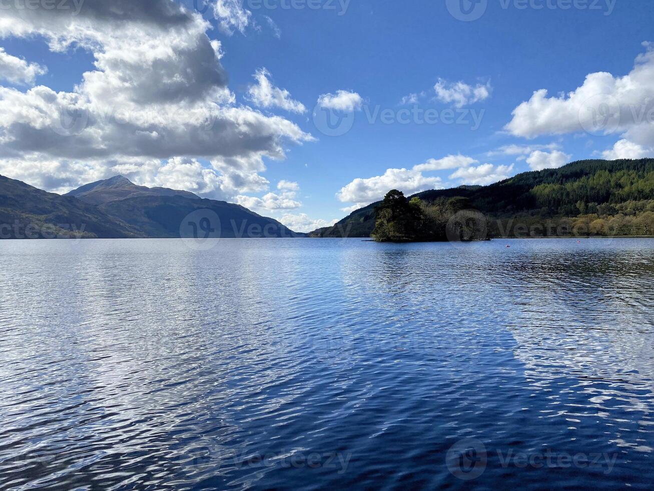 A view of Loch Lomond in Scotland on a sunny day photo