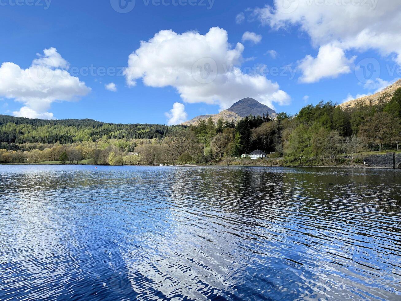A view of Loch Lomond in Scotland on a sunny day photo
