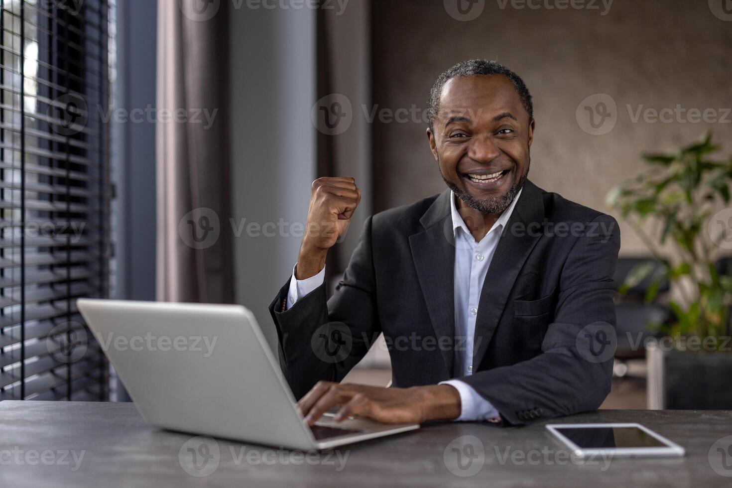 Portrait of mature experienced man businessman winner, senior african american boss joyful looking at camera, holding hands up in triumph gesture, celebrating successful achievement results. photo