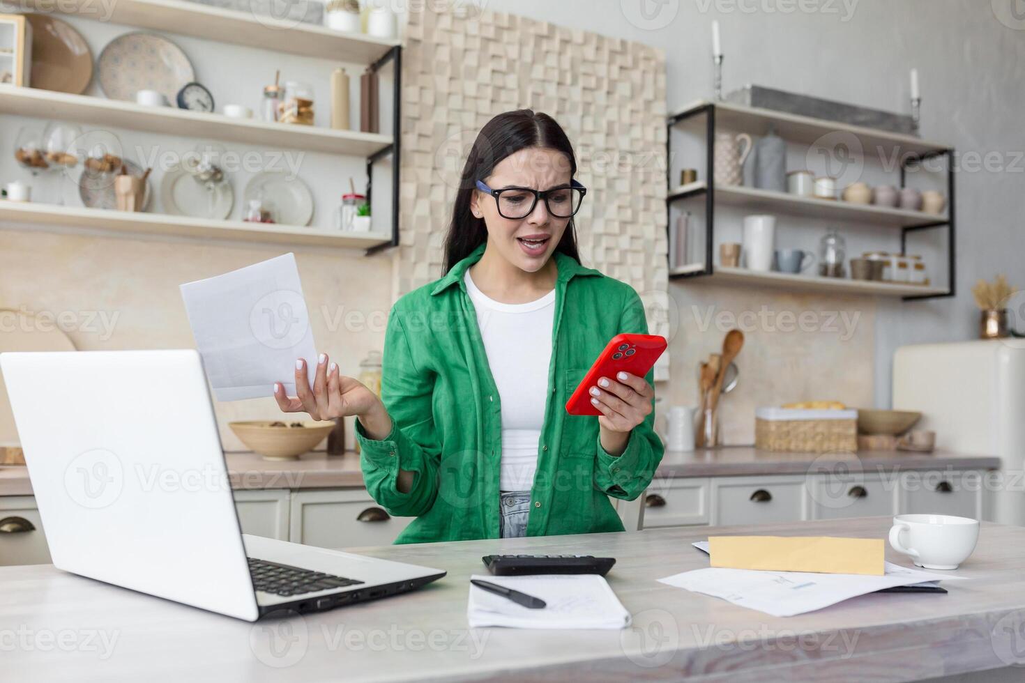 disappointed woman at home with paper work, brunette in kitchen counting bills. photo