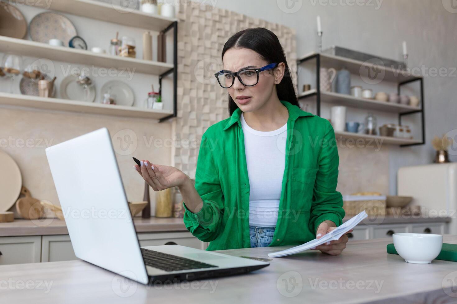 Domestic office. Positive millennial indian female freelancer work on laptop from home photo