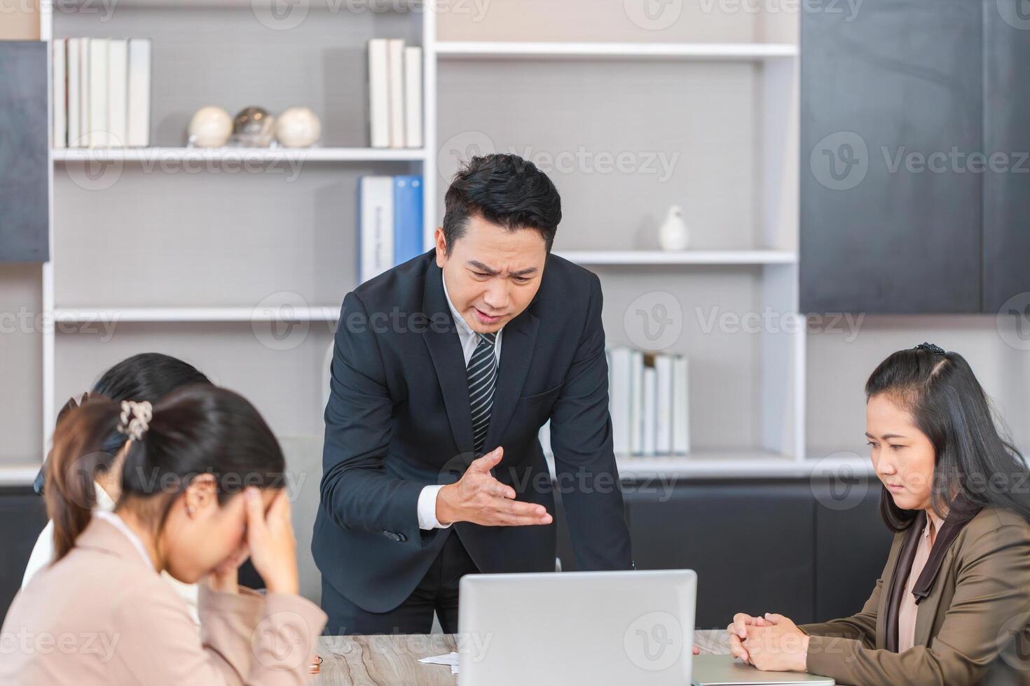 Serious meeting, managers with diverse coworkers team at meeting room. Group of coworkers in a conference room during the meeting photo