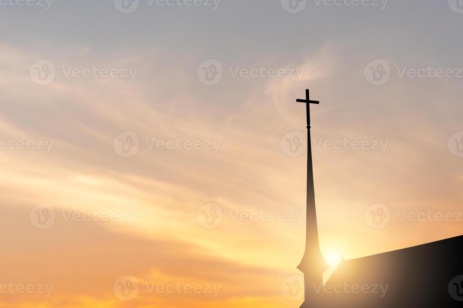 Silhouette of the cross on the church with blurred sunset background photo