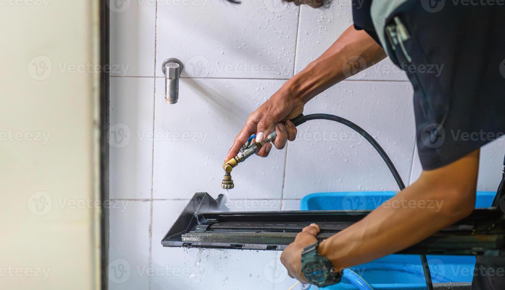 Repairman washing dirty inside compartments air conditioner, Technical clean mold in system air conditioning system photo