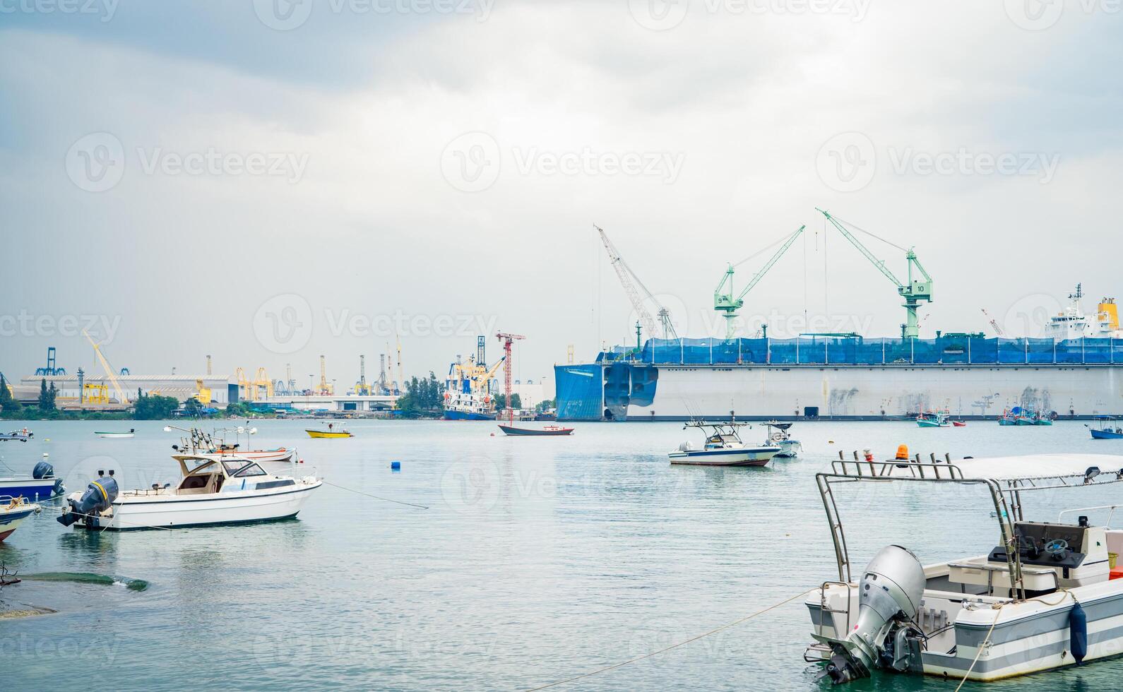Large ship docked peacefully at busy port. Vital role of maritime logistics and transport. Commercial ships at harbor, showcasing global shipping and logistics. Transportation and maritime industry. photo