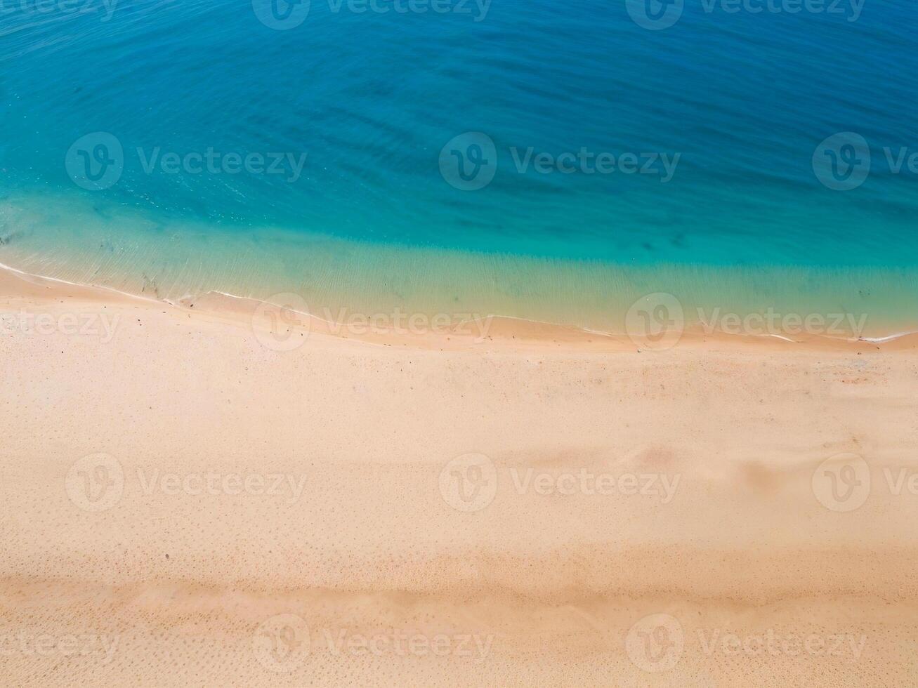 The ocean from a bird's eye view. Tropical sandy beach, clear water photo