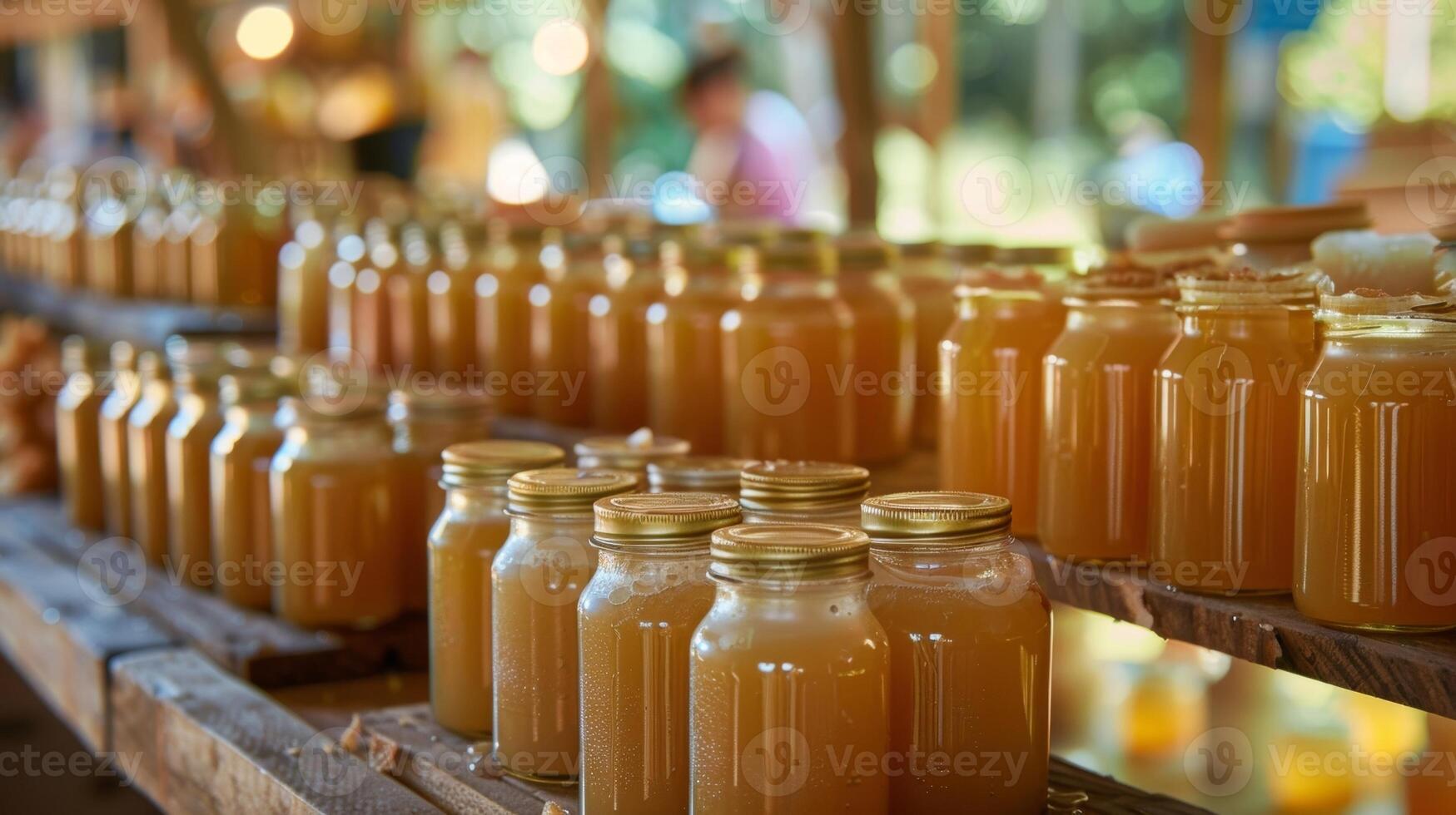 Locally sourced honey and beeswax candles at a stand run by a beekeeper photo