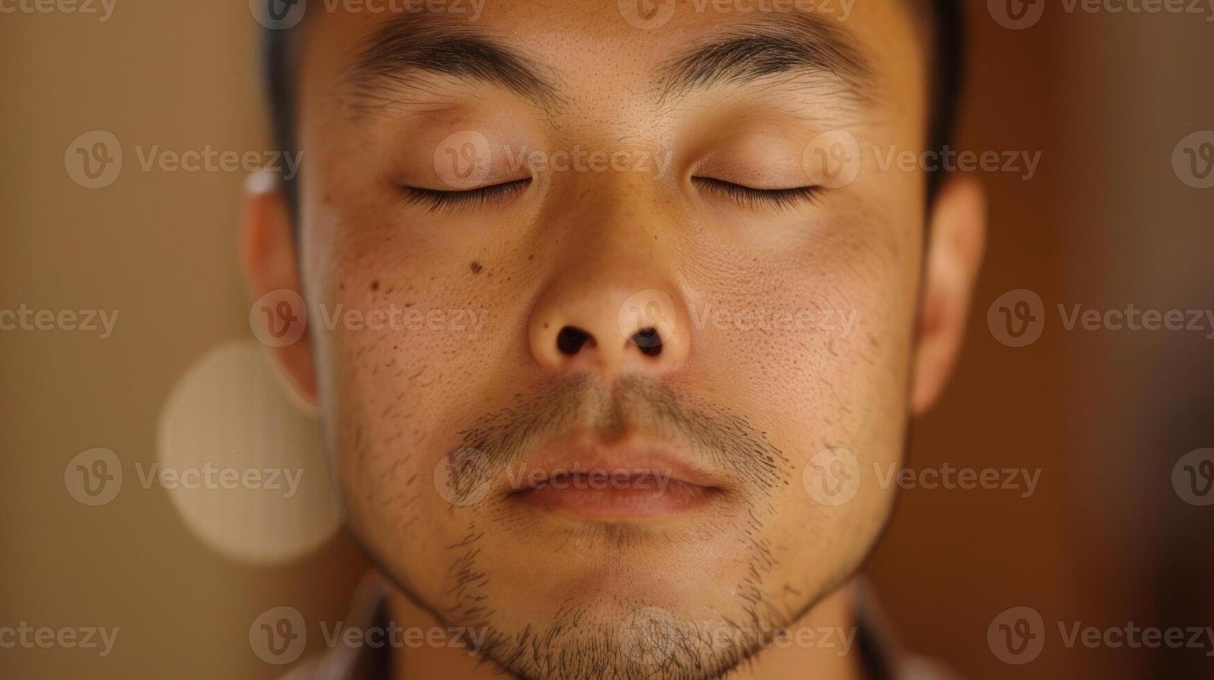 His eyes are closed as he takes a deep breath mentally preparing for the mindful tasting experience photo