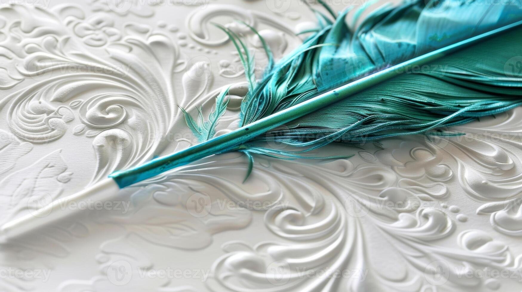 A jade green feather quill hovers over a crisp white page poised to create elegant swirls and flourishes with its iridescent ink photo