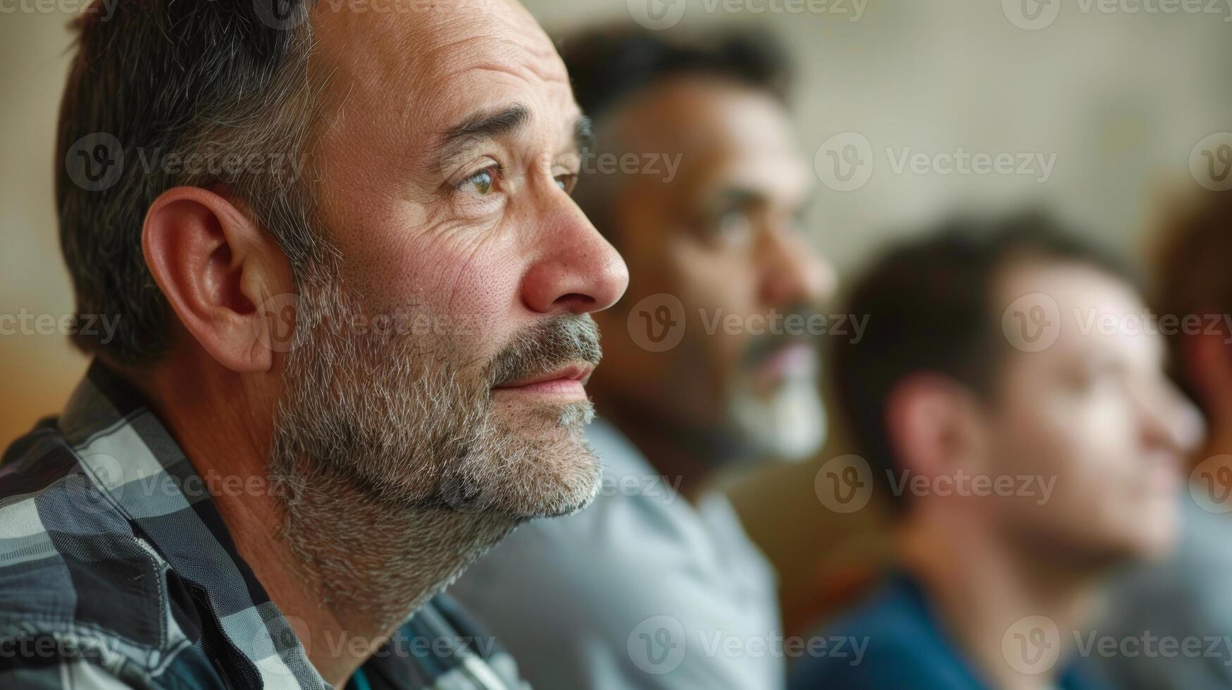 A group of men at a support group meeting listening and offering empathy to one anothers struggles photo