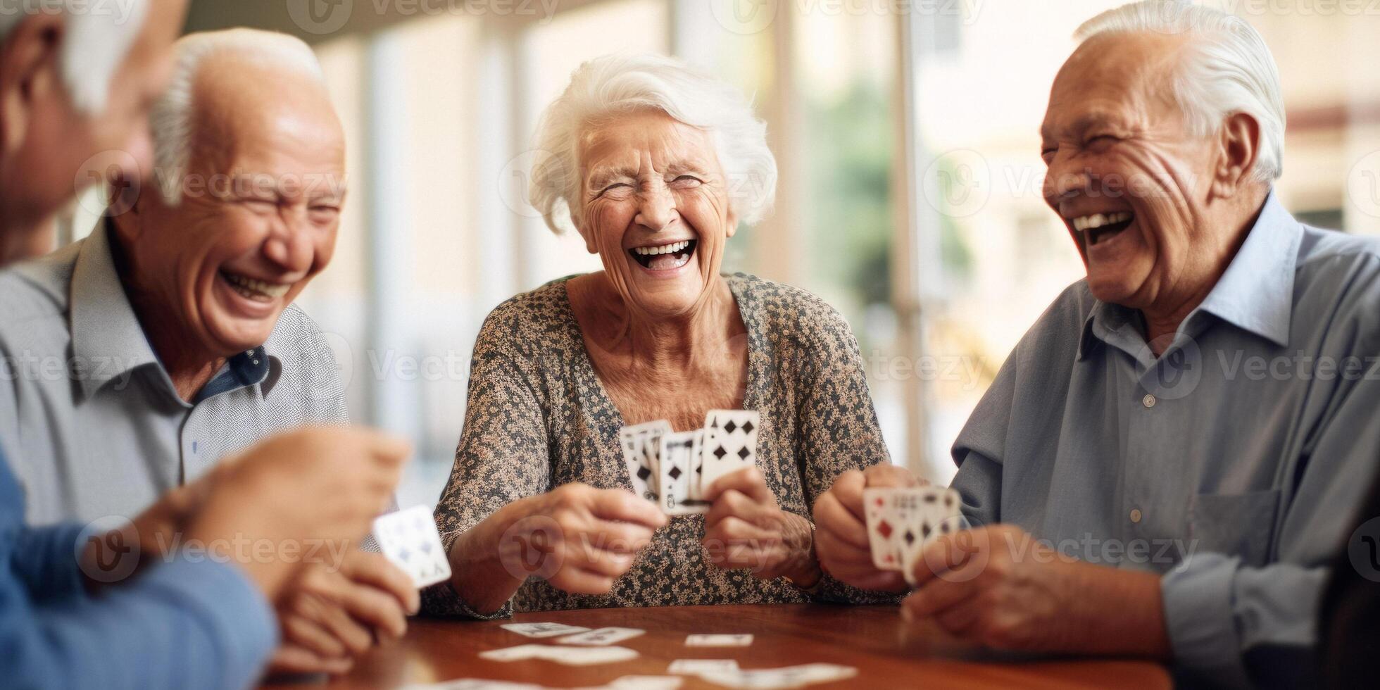elderly people playing cards in a nursing home photo