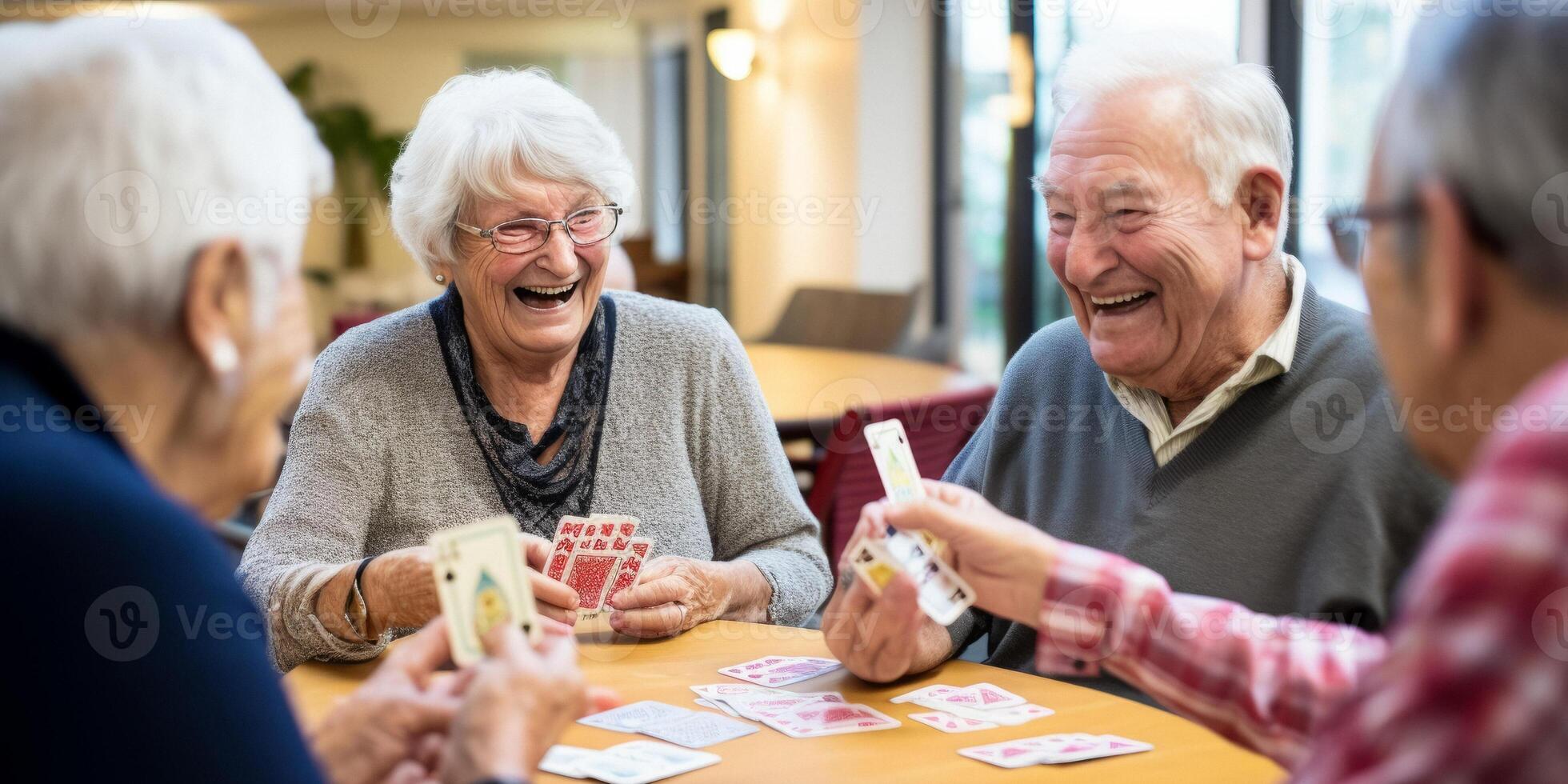 elderly people playing cards in a nursing home photo