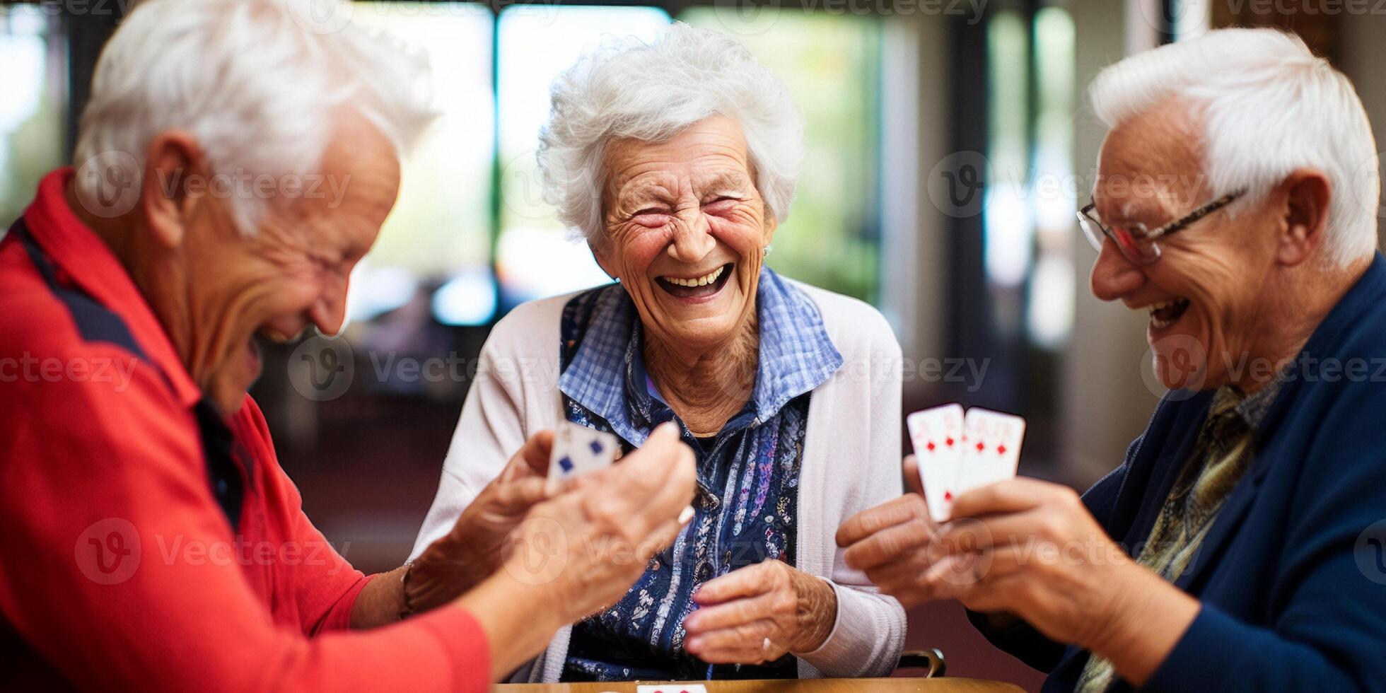 elderly people playing cards in a nursing home photo