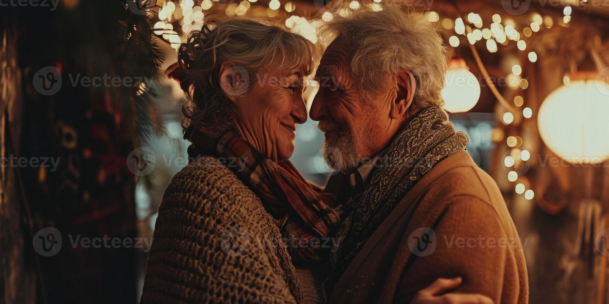 elderly couple in love hugging outside photo