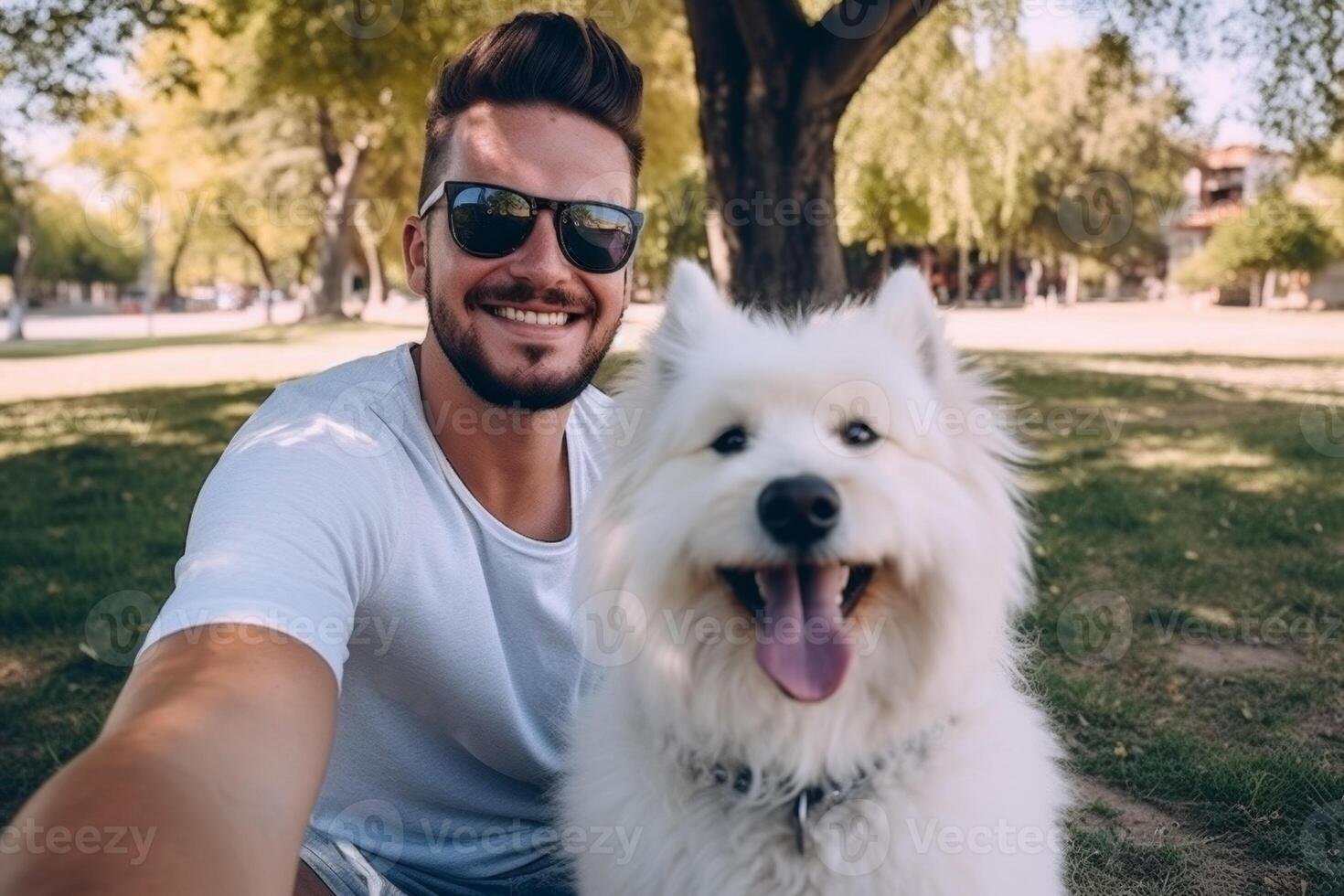 Selfie of a man with a dog in the park photo