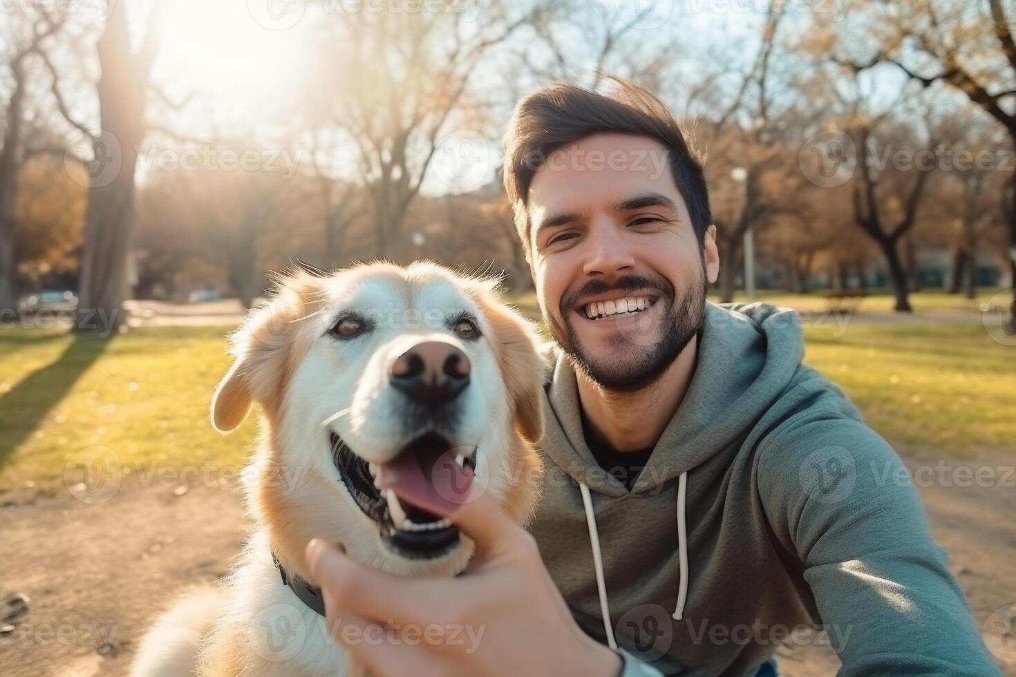 Selfie of a man with a dog in the park photo