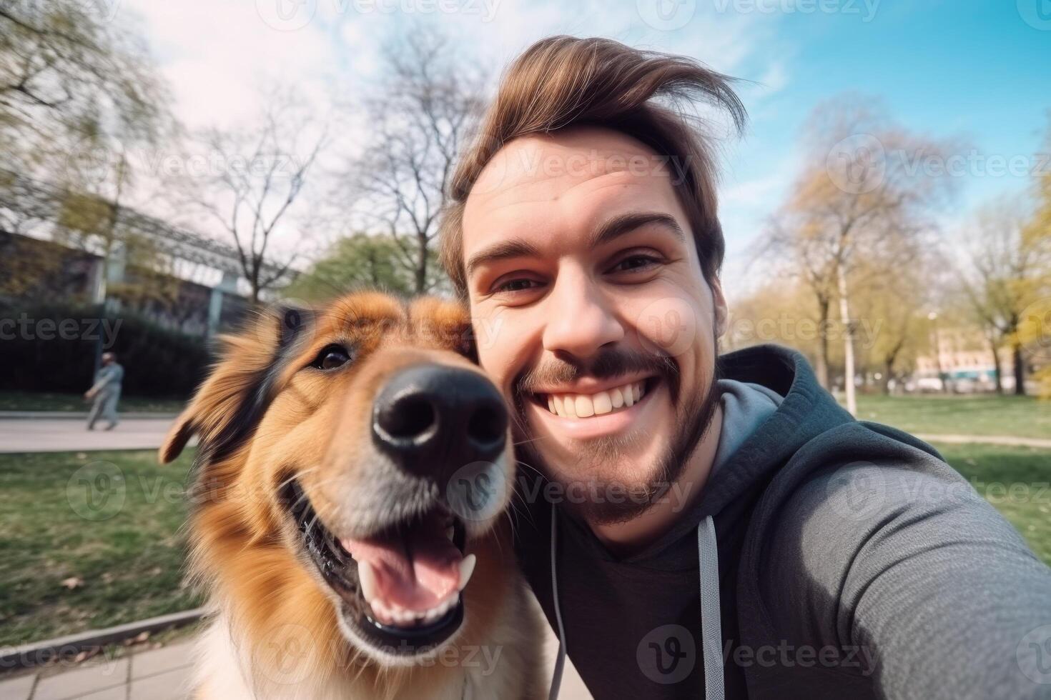 Selfie of a man with a dog in the park photo