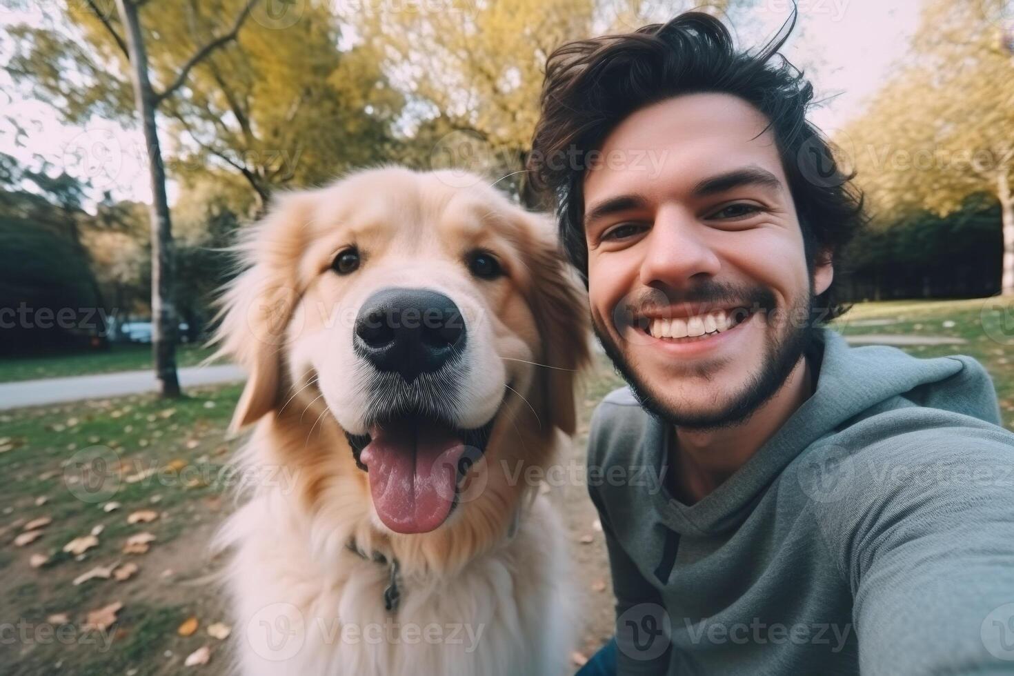 Selfie of a man with a dog in the park photo