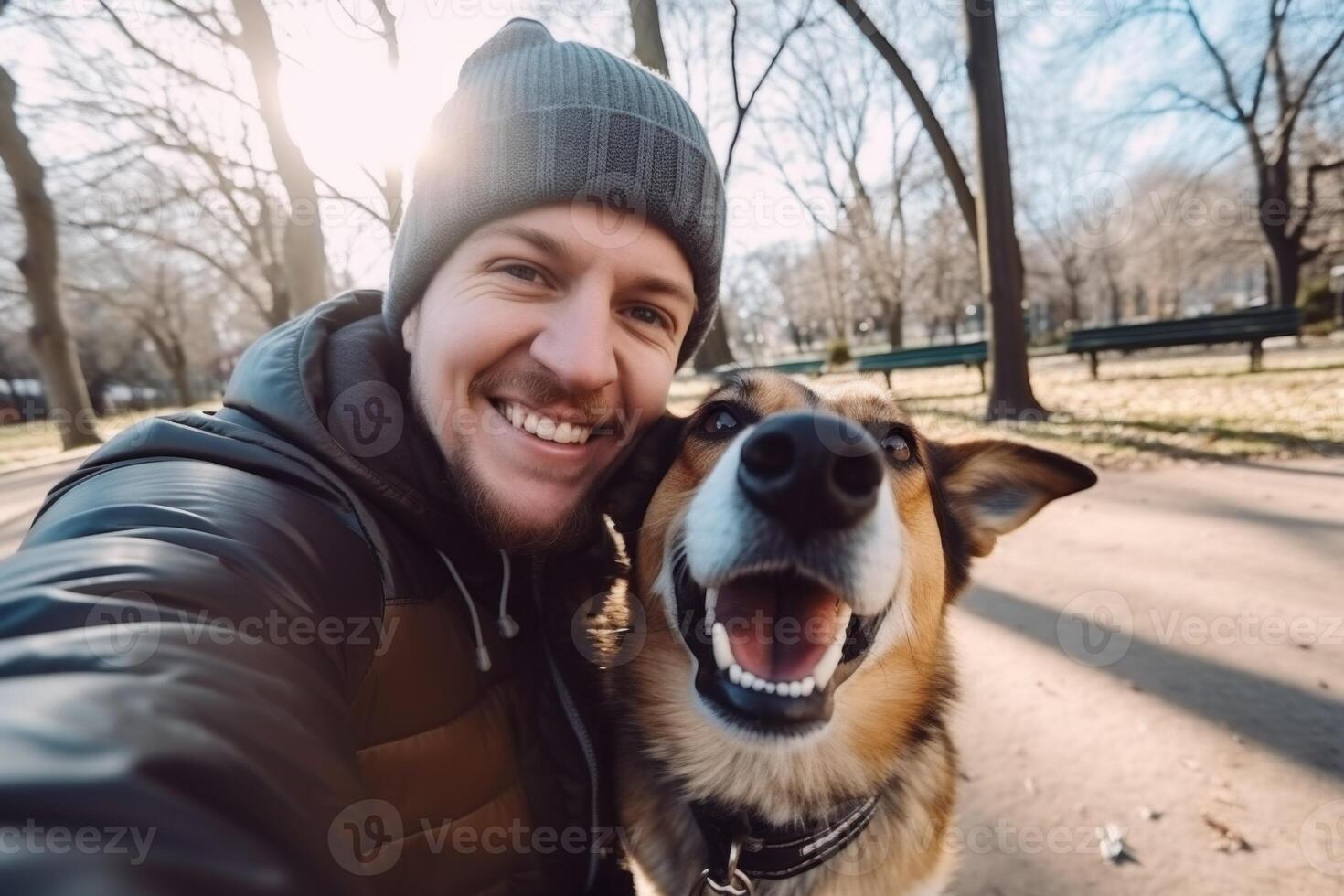 Selfie of a man with a dog in the park photo