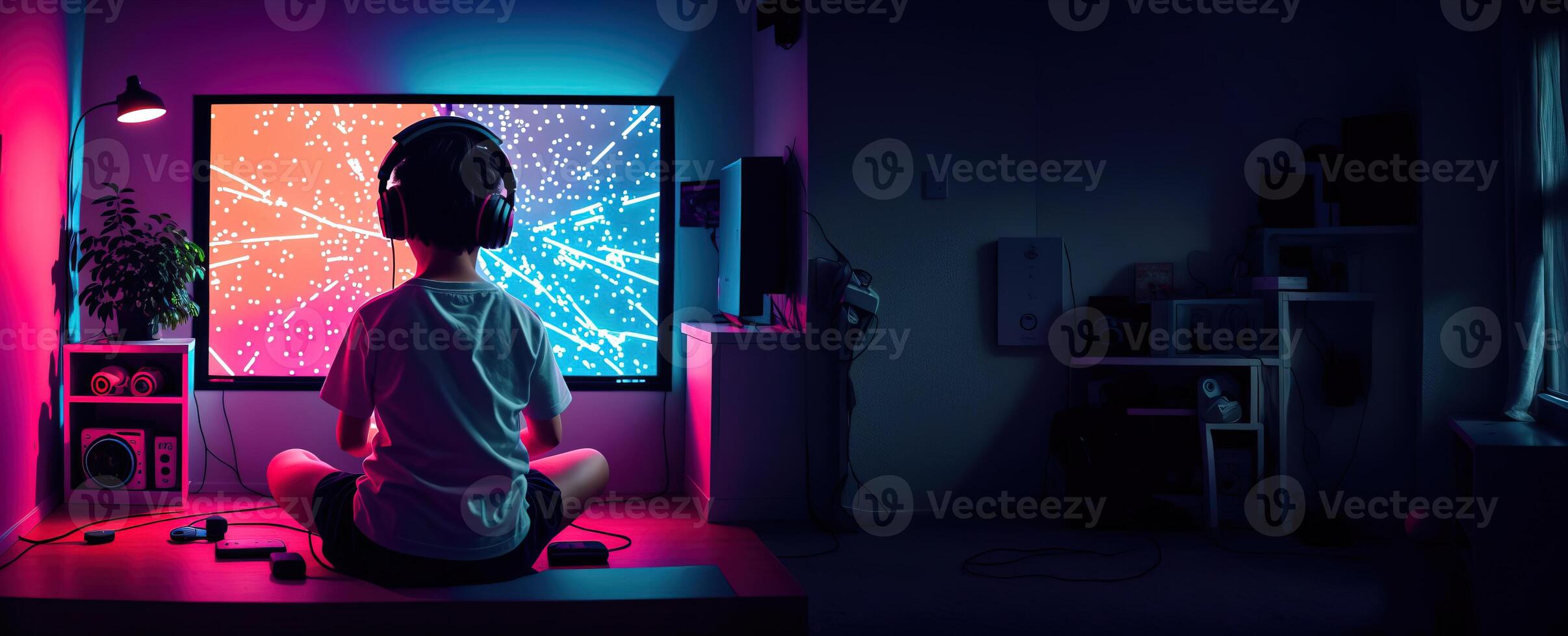 child in headphones playing a game in a dark room rear view banner panorama photo